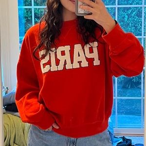 Orange ‘PARIS’ sweatshirt in size M from H&M